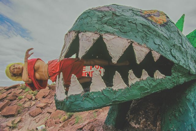 36-Woman eating dinasaur-east of HolbrookAZ-1999.tiff